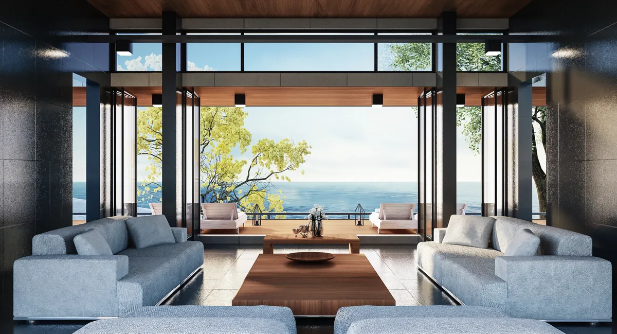 Salon contemporain donnant sur la terrasse par de grandes portes vitrées.
